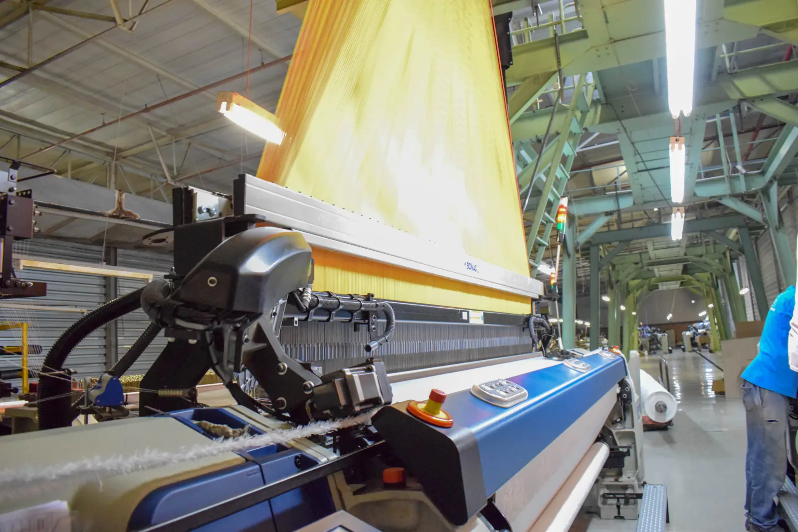 Jacquard fabric being woven on a wide loom